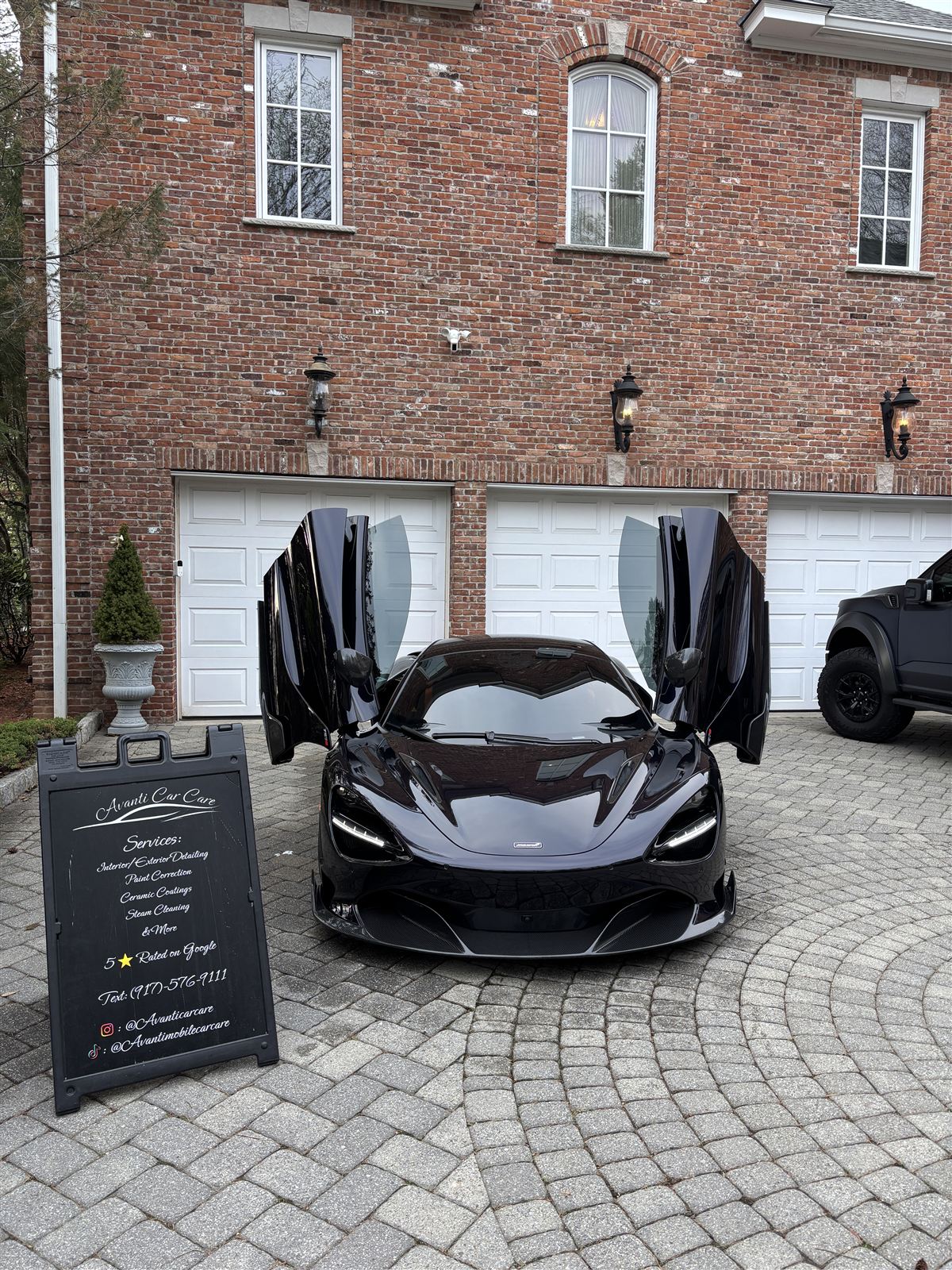 Black McLaren 720S with butterfly doors open after full mobile detail by Avanti Car Care in Bergen County NJ