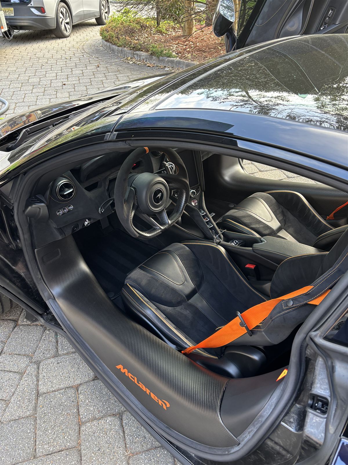 McLaren carbon fiber interior with orange accents after interior detailing in Bergen County NJ